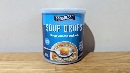 A blue can labelled “Progresso Soup Drops: Soup you can suck on”